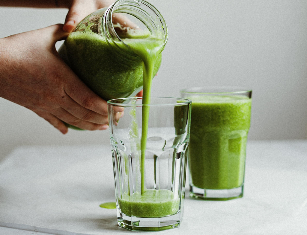 green juice poured into a glass